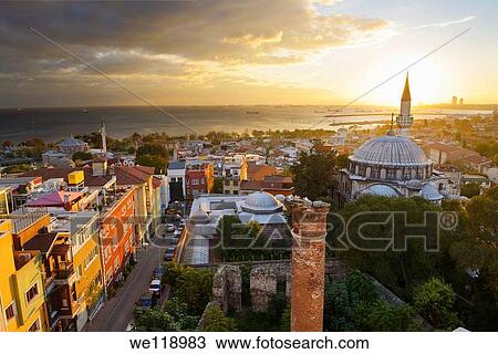 Setting sun behind the Sokollu Mehmet Pasha mosque minaret with golden glow on houses and Marmara Sea Istanbul View Large Photo Image Stock Image - Setting sun behind the Sokollu Mehmet Pasha mosque minaret with golden glow on houses and Marmara Sea Istanbul. Fotosearch