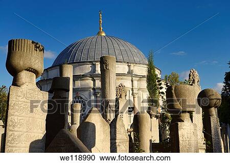 Stock Image - Sun on grave stones and Mausoleum in the Ottoman cemetery at Eyup Sultan Mosque Istanbul. Fotosearch
