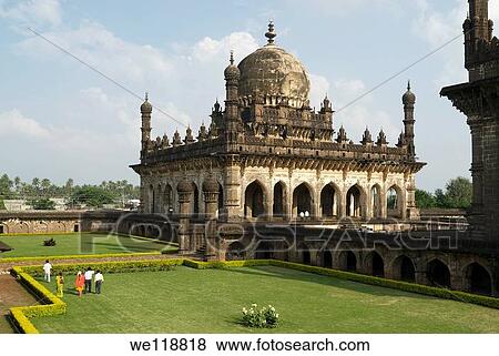 Stock Photo - The Ibrahim-Rauza, built by Ibrahim? Adil Shah II ruled1580-1627, consists of his tomb and mosque within a square compound, both rising face to face from a common raised terrace, with a tank and fountain between them The mosque has a rectangular prayer-c. Fotosearch