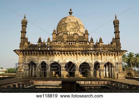 Stock Photo - The Ibrahim-Rauza, built by Ibrahim? Adil Shah II ruled1580-1627, consists of his tomb and mosque within a square compound, both rising face to face from a common raised terrace, with a tank and fountain between them The mosque has a rectangular prayer-c. Fotosearch