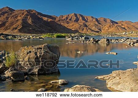 Stock Image - Valley of the Orange River in the Richtersveld Transfrontier National Park, view across the river to Namibia, South Africa. Fotosearch