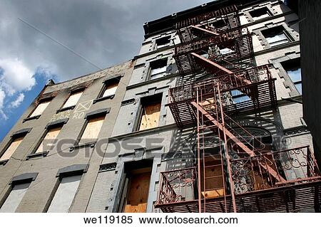 Stock Photography - Boarded up facade of Foreclosed building in New York City. Fotosearch