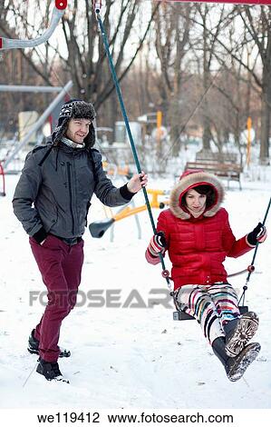 Couple spending a day in a snowy park in Bucharest, Romania View Large Photo Image Stock Image - Couple spending a day in a snowy park in Bucharest, Romania. Fotosearch