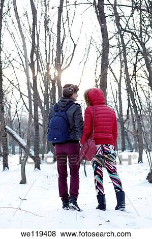 Couple spending a day in a snowy park in Bucharest, Romania View Large Photo Image Stock Photo - Couple spending a day in a snowy park in Bucharest, Romania. Fotosearch