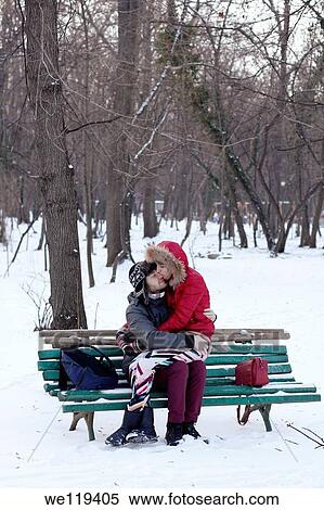 Couple spending a day in a snowy park in Bucharest, Romania View Large Photo Image Stock Photography - Couple spending a day in a snowy park in Bucharest, Romania. Fotosearch
