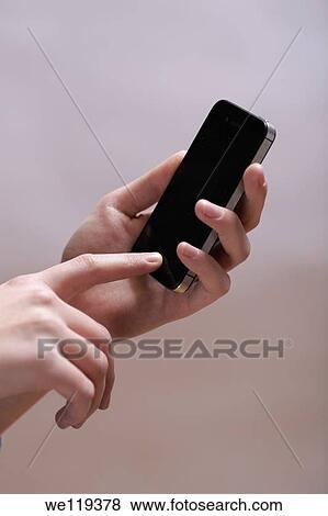 Hands with phone View Large Photo Image Stock Photo - Hands with phone. Fotosearch