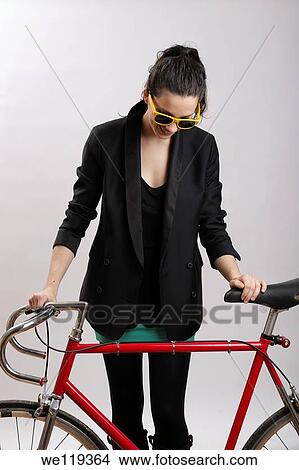 Hipster girl with red bike View Large Photo Image Picture - Hipster girl with red bike. Fotosearch