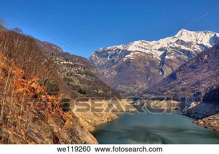 lake and snow-capped mountain with an alpine village View Large Photo Image Stock Image - lake and snow-capped mountain with an alpine village. Fotosearch