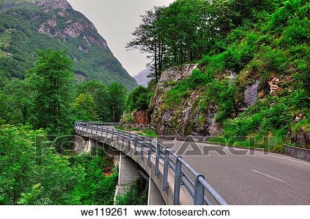 Mountain road with green trees and mountain View Large Photo Image Stock Image - Mountain road with green trees and mountain. Fotosearch
