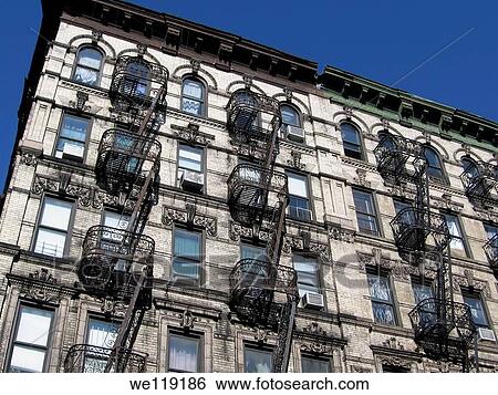 New York tenement house facade with fire escapes View Large Photo Image Stock Photograph - New York tenement house facade with fire escapes. Fotosearch
