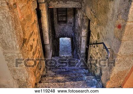 Old colorful stone alley with stairs down View Large Photo Image Stock Photo - Old colorful stone alley with stairs down. Fotosearch