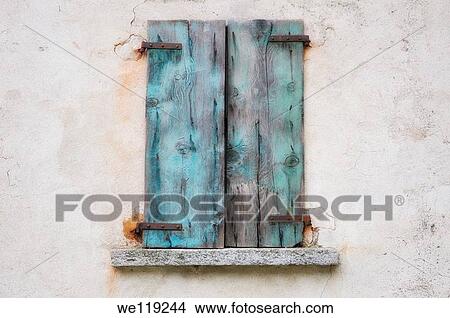 Old window with blue shutter in wood View Large Photo Image Picture - Old window with blue shutter in wood. Fotosearch