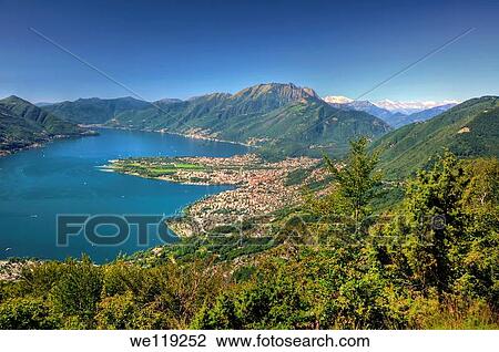 Panoramic view over an alpine lake with mountain View Large Photo Image Stock Image - Panoramic view over an alpine lake with mountain. Fotosearch