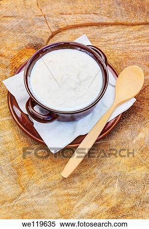 Bowl of organic goat yogurt with wooden spoon View Large Photo Image Stock Photography - Bowl of organic goat yogurt with wooden spoon. Fotosearch