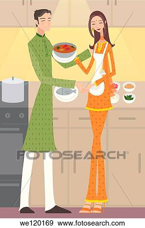 Couple preparing food in a kitchen View Large Photo Image Stock Photo - Couple preparing food in a kitchen. Fotosearch
