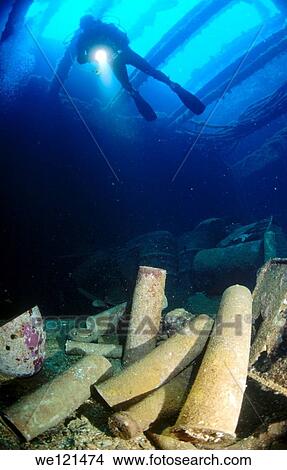 Diver and artillery shells of Fujikawa Maru in Truk Lagoon View Large Photo Image Picture - Diver and artillery shells of Fujikawa Maru in Truk Lagoon. Fotosearch