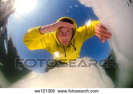 Diver looking into an ice hole, subglacial diving, ice diving, in the frozen Black Sea, a rare phenomenon, last time it occured in 1977, Odessa, Ukraine, Eastern Europe View Large Photo Image Stock Photography - Diver looking into an ice hole, subglacial diving, ice diving, in the frozen Black Sea, a rare phenomenon, last time it occured in 1977, Odessa, Ukraine, Eastern Europe. Fotosearch