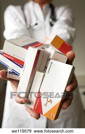 Doctor holding pills -close-up View Large Photo Image Stock Photo - Doctor holding pills -close-up. Fotosearch