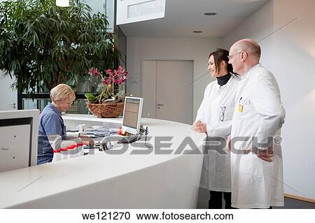 Doctors at the reception of modern hospital View Large Photo Image Stock Image - Doctors at the reception of modern hospital. Fotosearch