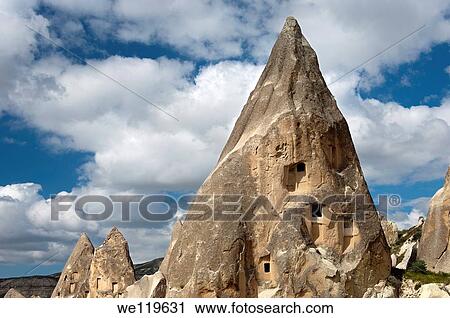 Eroded tuff rock with access openings to storage rooms and dovecotes, Goereme National Park, Cappadocia, Turkey View Large Photo Image Stock Image - Eroded tuff rock with access openings to storage rooms and dovecotes, Goereme National Park, Cappadocia, Turkey. Fotosearch