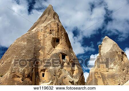 Eroded tuff rock with access openings to storage rooms and dovecotes, Goereme National Park, Cappadocia, Turkey View Large Photo Image Stock Image - Eroded tuff rock with access openings to storage rooms and dovecotes, Goereme National Park, Cappadocia, Turkey. Fotosearch
