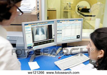 Female doctor and nurse monitoring MRI scan in progress View Large Photo Image Stock Photograph - Female doctor and nurse monitoring MRI scan in progress. Fotosearch