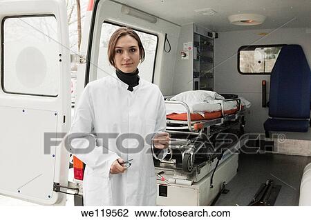Female doctor standin by ambulace View Large Photo Image Stock Image - Female doctor standin by ambulace. Fotosearch