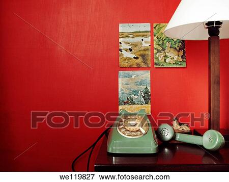 Green vintage telephone on a red background View Large Photo Image Stock Photo - Green vintage telephone on a red background. Fotosearch