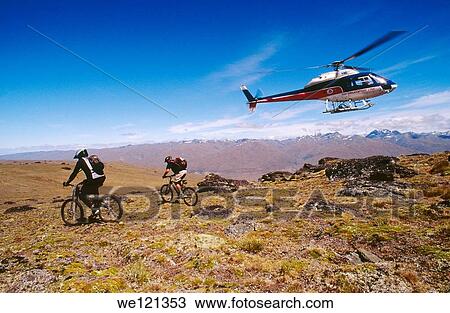 Stock Image - Heli-mountain biking Central Otago South Island New Zealand. Fotosearch