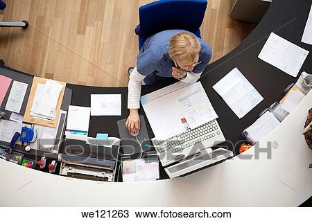 Hospital reception-receptionist at work View Large Photo Image Stock Image - Hospital reception-receptionist at work. Fotosearch
