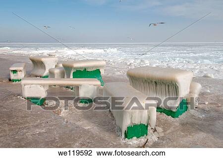 Icy cafe tables and benches on the beach of the frozen Black Sea, a rare phenomenon, last time it occured in 1977, Odessa, Ukraine, Eastern Europe View Large Photo Image Stock Image - Icy cafe tables and benches on the beach of the frozen Black Sea, a rare phenomenon, last time it occured in 1977, Odessa, Ukraine, Eastern Europe. Fotosearch