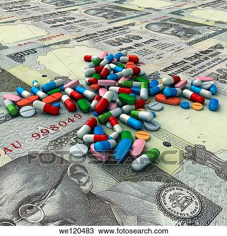 Stock Image - Illustrative image of pills above Indian currencies representing health cost. Fotosearch