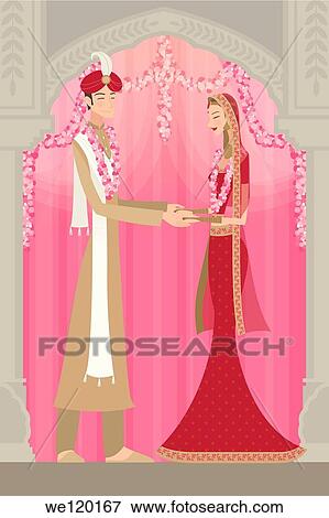 Stock Photo - Indian bride and groom in traditional dress at wedding ceremony. Fotosearch