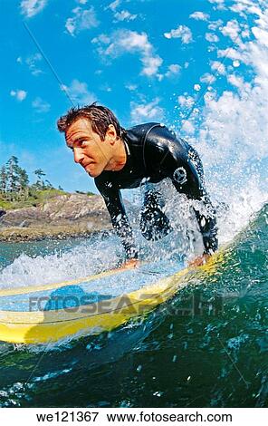 Stock Photo - Male surfer, aged 25-30 Tofino British Columbia Canada. Fotosearch