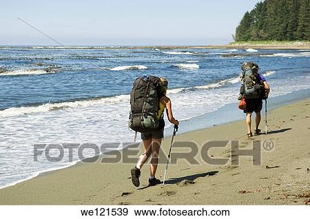 Man and woman walking on beach with rucksacks, West Coast Trail, British Columbia, Canada View Large Photo Image Stock Photo - Man and woman walking on beach with rucksacks, West Coast Trail, British Columbia, Canada. Fotosearch