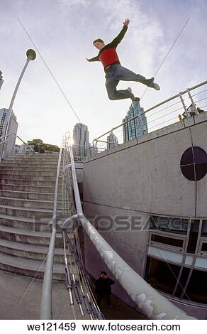 Man jumping over stairs parkour View Large Photo Image Stock Photo - Man jumping over stairs parkour. Fotosearch