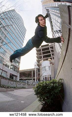 Man practicing parkour View Large Photo Image Stock Photo - Man practicing parkour. Fotosearch