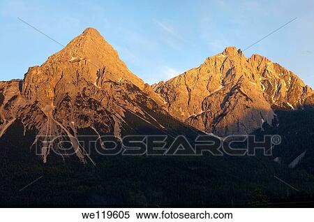 Peaks Ehrwalder Sonnenspitze and Gruenstein in the evening light, Ehrwald, Mieminger Kette, Tyrol, Austria View Large Photo Image Stock Photography - Peaks Ehrwalder Sonnenspitze and Gruenstein in the evening light, Ehrwald, Mieminger Kette, Tyrol, Austria. Fotosearch