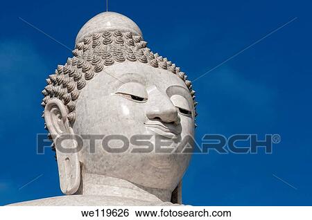 Stock Photograph - Portrait of the Big Buddha made of Burmese Alabaster, Chalong, Phuket, Thailand. Fotosearch