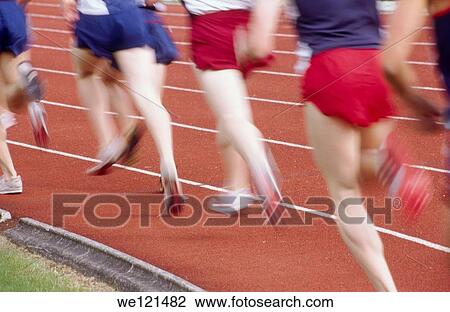 Stock Image - Runners on track. Fotosearch