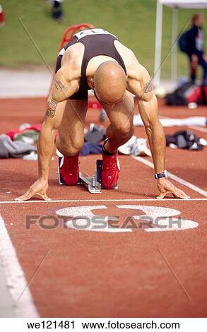 Sprinter in blocks View Large Photo Image Stock Image - Sprinter in blocks. Fotosearch
