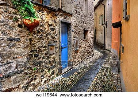 Tight alley with old rustic houses View Large Photo Image Picture - Tight alley with old rustic houses. Fotosearch