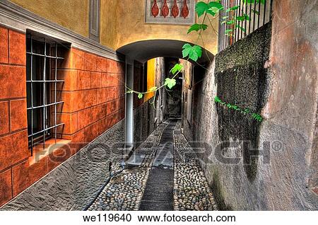 Tight alley with old rustic houses View Large Photo Image Stock Image - Tight alley with old rustic houses. Fotosearch