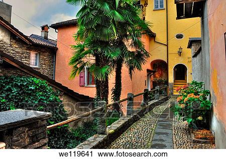 Tight alley with old rustic houses View Large Photo Image Stock Image - Tight alley with old rustic houses. Fotosearch