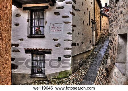 Tight alley with old rustic houses View Large Photo Image Stock Photograph - Tight alley with old rustic houses. Fotosearch