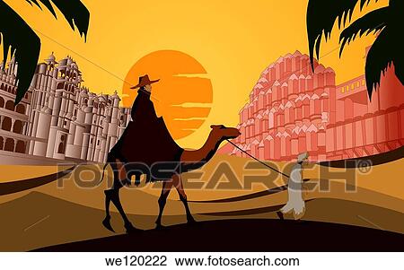 Stock Image - Tourist riding a camel in front a palace, Hawa Mahal, Jaipur, Rajasthan, India. Fotosearch