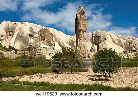 Tower-like tuff rock cones or fairy chimneys, Goereme National Park, Goereme, Cappadocia, Turkey View Large Photo Image Stock Photo - Tower-like tuff rock cones or fairy chimneys, Goereme National Park, Goereme, Cappadocia, Turkey. Fotosearch
