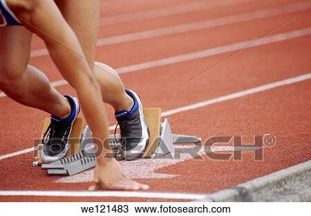 Track athlete in blocks View Large Photo Image Stock Image - Track athlete in blocks. Fotosearch