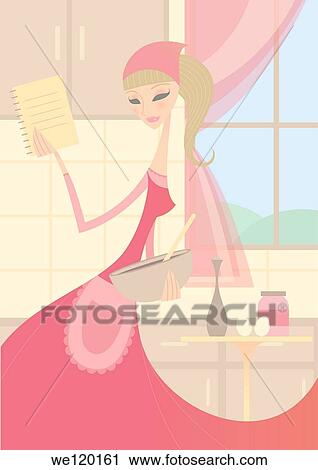 Stock Image - Woman preparing food in the kitchen with the help of recipe book. Fotosearch