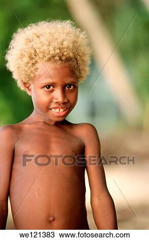 Young boy, aged 6-8 New Ireland province Papua New Guinea View Large Photo Image Stock Image - Young boy, aged 6-8 New Ireland province Papua New Guinea. Fotosearch